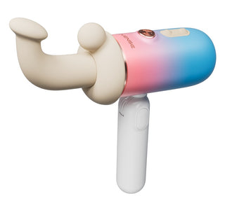 Handhållen L-formad vibrator i slätt material med rosa till blå färgskala och böjt beige tillbehör.