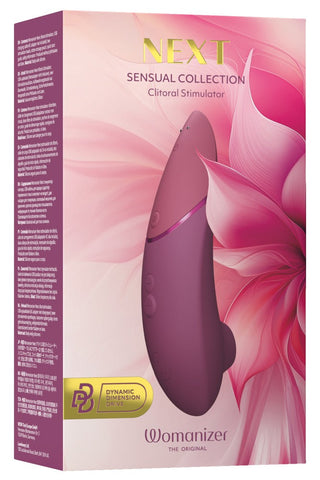 Womanizer NEXT Sensual Collection i en rosa blommig ask, visad med en bild av produkten som har ett slätt material och en elegant design.