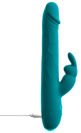 En turkosfärgad silikonvibrator i kaninform med vågmönster, utrustad med en laddningskabel, avbildad mot en vit bakgrund.