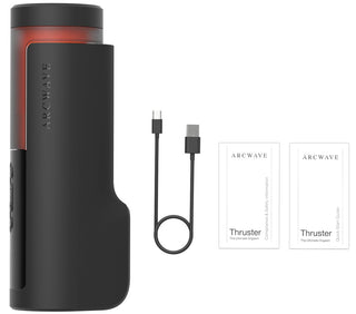 Svart Arcwave Thruster, matt svart yta med rotationsfunktion, avbildad tillsammans med en USB-C-kabel och två bruksanvisningar på en vit yta.