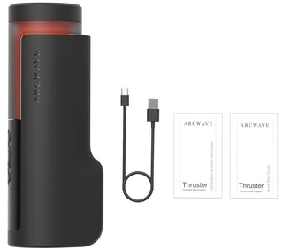 Svart Arcwave Thruster, matt svart yta med rotationsfunktion, avbildad tillsammans med en USB-C-kabel och två bruksanvisningar på en vit yta.