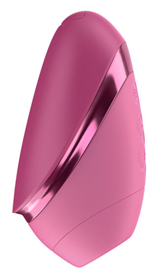 Rosa, oval Womanizer Next Liberty med knappar, metallicdetaljer och 3D-design, tillverkad av ett mjukt material.