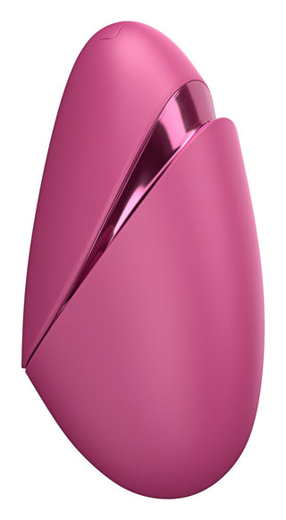 Rosa oval Womanizer Next Liberty-massager med metalliska detaljer, slät yta och synlig Pleasure Air-öppning.