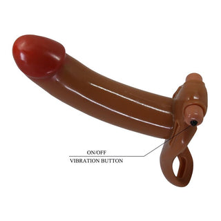 Brun ihålig strap-on dildo med röd spets, on/off-knapp och justerbar sele av syntetmaterial.