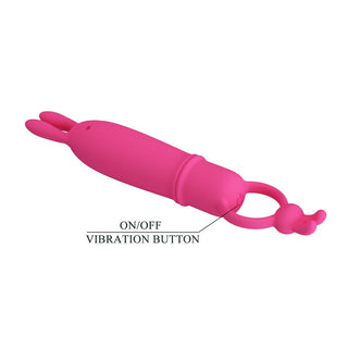 Rosa bulletvibrator i silikon med kaninörondesign och en på/av-knapp som indikeras med en liten pil.