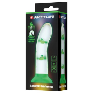 Självlysande dildo tillverkad av grön kroppssäker silikon med detaljer i kanindesign. Boxförpackning synlig.