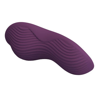 Lila silikonvibrator med vågiga kanter, visas på en vit bakgrund.