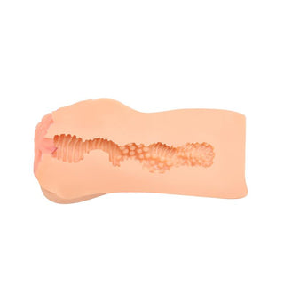 Vaginal onaniprodukt i silikon i hudfärgad nyans med realistisk öppning och strukturerad insida.