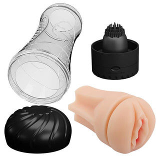 Transparent cylindrisk vibrator med räfflad innerhylsa och köttfärgad insats, produktdelar visas separat.
