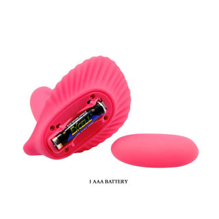 Stimulator i rosa silikon med clamshell-design, fjärrkontroll och matchande lock till batterifacket.