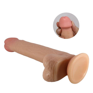 Rosa dildo i silikon, 22 cm lång, med böjbar kärna och sugproppsfot. Närbild på den detaljerade toppen.