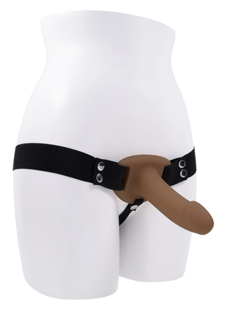 En mannekängtorso visar Hollow Strap-On Dildo 16 cm, med justerbara remmar och en brun dildo påsatt.