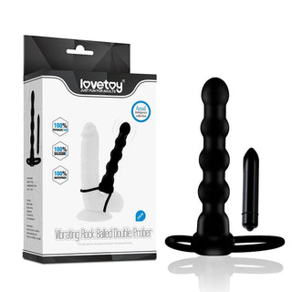 Förpackning och produktbild av Lovetoy Dubbel Trouble Penisring, en mångsidig dubbeländad vuxenleksak med en bullet vibratorinsats som också kan användas som en buttplug för extra njutning.
