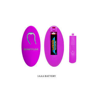 G-punktsstimulator i lila silikon, oval med avtagbart lock, på bilden tillsammans med ett enda AAA-batteri.