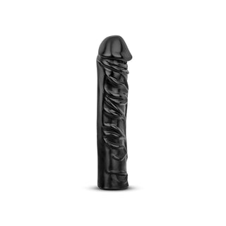 Realistisk XXL Dildo 33 cm står upprätt på en vit bakgrund, designad för extrem njutning och intensiv stimulans.