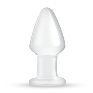 Gildo Glass Buttplug 4,6 cm, tillverkad av temperaturkänsligt borosilikatglas, står upprätt med en bred bas och avsmalnande spets på en vit bakgrund.