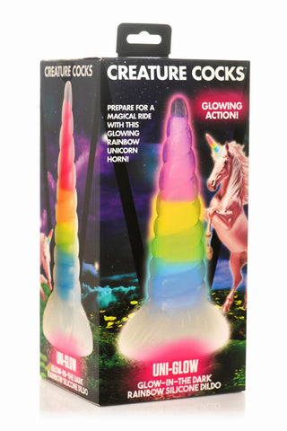 Box av XR Brands Unicorn Horn Dildo, gjord av flexibel silikon med enhörningsbilder och självlysande glöd-i-mörker-funktioner.
