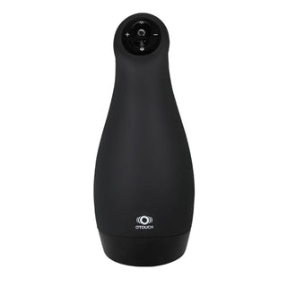 Airturn 3 - Automatisk Masturbator är en elegant svart enhet med kontrollknappar på toppen och OTOUCH-loggan längst ner framtill, designad med vibrationer och knottror för ökad njutning.
