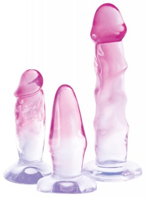 You2Toys Crystal Clear Analset har tre rosa och vita gradientglasobjekt i olika former och storlekar som vilar elegant på en vit bakgrund, utrustad med säker sugkoppsbaser för ökad stabilitet.