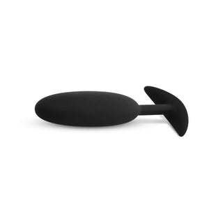Buttplug Med Tyngd Small är tillverkad av kroppsäkert silikon med en avsmalnande bas och en skarp vit bakgrund, perfekt för dem som söker komfort och pålitlighet i intima äventyr.