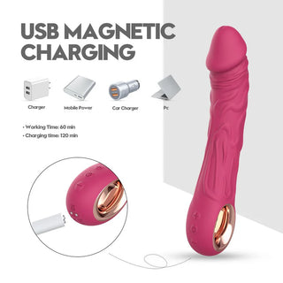 Rosa silikonvibrator med realistiska detaljer och synlig magnetisk USB-laddningsport.