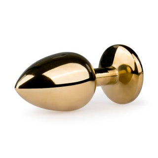 Guld Metall Buttplug - Med Kristall är en polerad, guldfärgad buttplug med en avsmalnande ände, platt bas och eleganta kristalldetaljer.