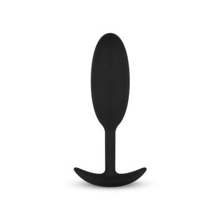 Buttplug Med Tyngd Medium" är en svart analplugg tillverkad av kroppssäkert silikon, designad med en oval form och en utsvängd bas för säkerhet.