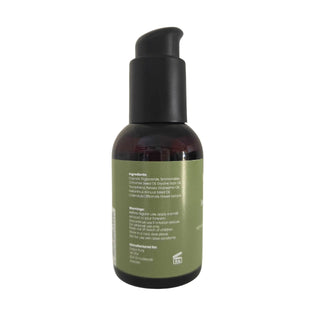 En brun plastflaska med svart pump och grön etikett innehållande Dalya Pure Intim Oilcare 100 ml.