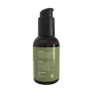 En brun plastflaska med svart pump och grön etikett innehållande Dalya Pure Intim Oilcare 100 ml.