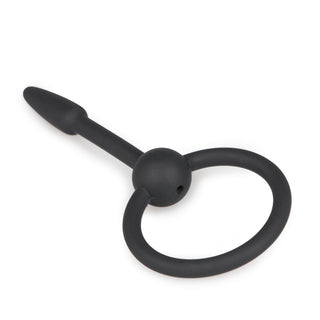 Silikon Dilator Penisplug är en svart silikonring med en bifogad avsmalnande propp, perfekt för Urinrör Stimulering, visad mot en vit bakgrund.