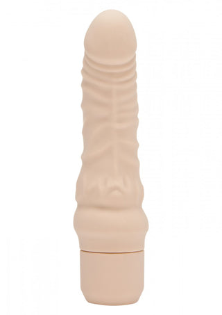 Get Real Mini Dildovibrator, ett beige, cylindriskt föremål med en strukturerad yta, står upprätt mot en vit bakgrund.