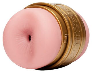 Fleshlight Quickshot - Anal & Vagina är en cylindrisk vuxenleksak med guldfodral och mjukt rosa inlägg, utformad för att öka uthålligheten och berika din upplevelse. Denna eleganta sexleksak erbjuder elegans och tillfredsställelse i intima stunder.