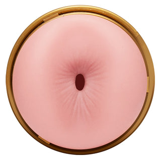 Det runda, rosa föremålet med ett virvelmönster och en central öppning liknar Fleshlight Quickshot - Anal & Vagina och framkallar uthållighet och intriger som en fängslande sexleksak.