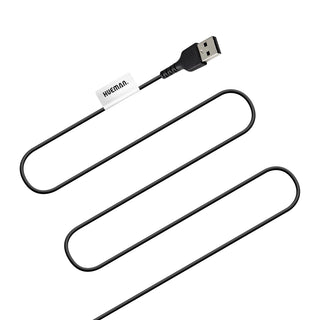 En vågig svart USB-kabel med en vit HUEMN-etikett integreras sömlöst med Hueman Vibrerande Analplugg & Ring, vilket förbättrar upplevelsen med vibrationsinställningar.