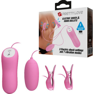 Svarta bröstklämmor med vibro-bullets och fjärrkontroll i metall och plast, förpackning synlig i bakgrunden.