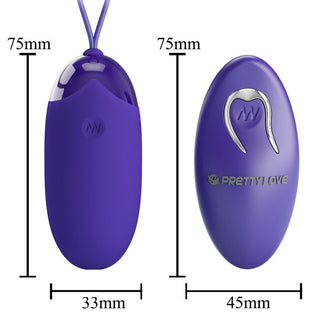 Två lila ovala enheter är illustrerade med märkta mått: den ena är en fjärrkontroll med en knapp och den andra liknar Pretty Love Berger Vibratorägg, med ett krokformat handtag för enkel användning.