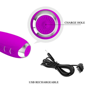 Hector-vibrator i lila silikon med E-stim, USB-laddningsbar, med märkt laddningsport och separat laddningskabel.