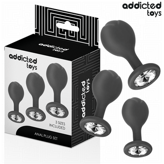 Tre svarta silikonbuttpluggar med dekorativ sten i botten, tillsammans med förpackning Addicted Toys Analpluggar 3-pack.