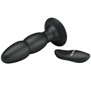 Svart roterande analplugg med utvidgad bas och trådlös fjärrkontroll med vibrationsfunktion.