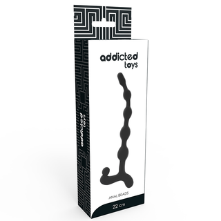 Lådförpackningen till Addicted Toys Anal Balls 22 cm, tillverkad av slätt TPR-material, visar leksakens silhuett över en geometrisk svartvit bakgrund.