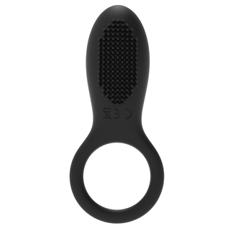 Penisring med Fjärrkontroll: En svart silikonring med strukturerad oval topp och cirkulärt handtag, visad mot vit bakgrund.