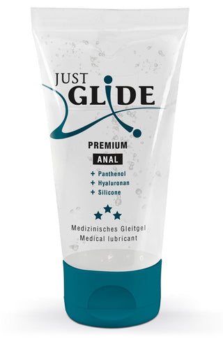 Just Glide Premium Anal medicinsk glidmedel erbjuder en lyxig upplevelse med Panthenol, Hyaluronan och Silikon. Den har blå text och grafik på en vit bakgrund med stjärnor som framhäver dess kvalitet.