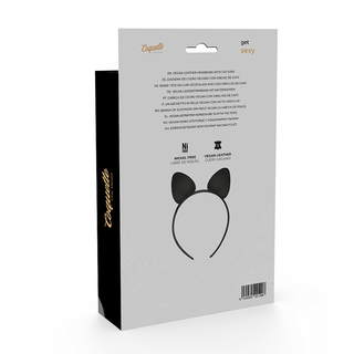 Förpackningen med Coquette-tillbehör innehåller "Kattöron Till Förspel", ett svart pannband med kattöron, perfekt för lekfulla kostymer och förspel, tillsammans med detaljerade produktbeskrivningar.