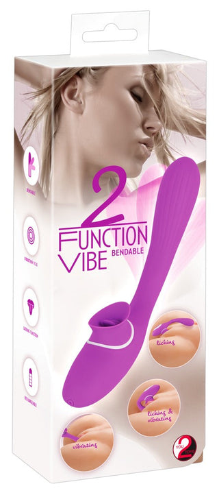 2 Funktion Vibrator Med Tunga - 22 cm är en lila vibrator designad för G-punkt och klitorisstimulans. Den har en strukturerad yta med olika funktionsikoner för ökad njutning.