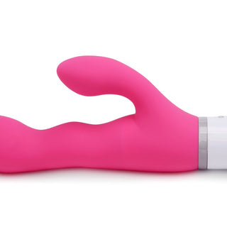 Lovense Nora, en rosa dubbelmotorig kaninvibrator i silikon med böjd design och vitt handtag, är perfekt för stimulering av G-punkt och klitoris. Den erbjuder exakt kontroll genom app fjärrstyrning, vilket lyfter varje upplevelse.
