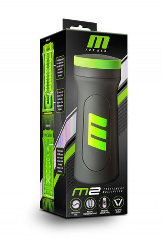 M For Men Stroker-förpackningen, i svart och grönt, har tekniska illustrationer och logotypen. Den är ergonomiskt utformad för optimal användning.