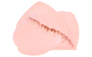 En närbild av ett abstrakt rosa föremål med mjuka, skiktade former och en taggig textur liknar Sally Masturbator för en realistisk upplevelse. Dess mjuka utseende och varierande rosa nyanser skapar en kontrasterande effekt.