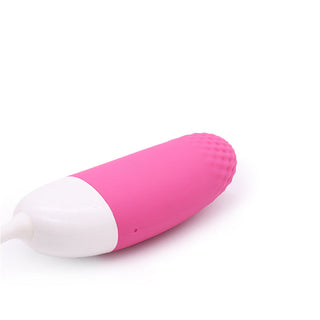 The Magic Motion Vini - Vibrerande Ägg är en rosa och vit kulformad vibrator med en strukturerad yta, som erbjuder appstyrt sexleksak-funktioner för en personlig upplevelse.