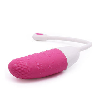 Upplev Magic Motion Vini, ett rosa och vitt vibrerande ägg designat för njutning med sin strukturerade yta, vattendroppar och långa flexibla handtag. Denna appstyrt sexleksak erbjuder en oförglömlig upplevelse skräddarsydd efter dina önskemål.