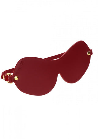 Röda skulpturala TabooM Bondage Ögonmask-solglasögon har en tjock båge med guld-accenterade skalmar.